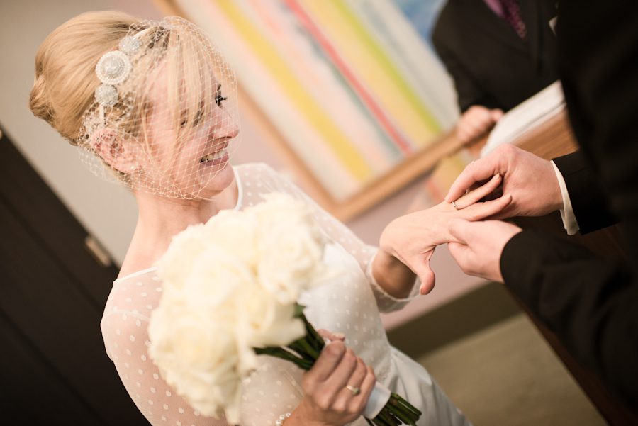 Ring exchange during a New York City Hall wedding. Captured by northern NJ wedding photographer Ben Lau.