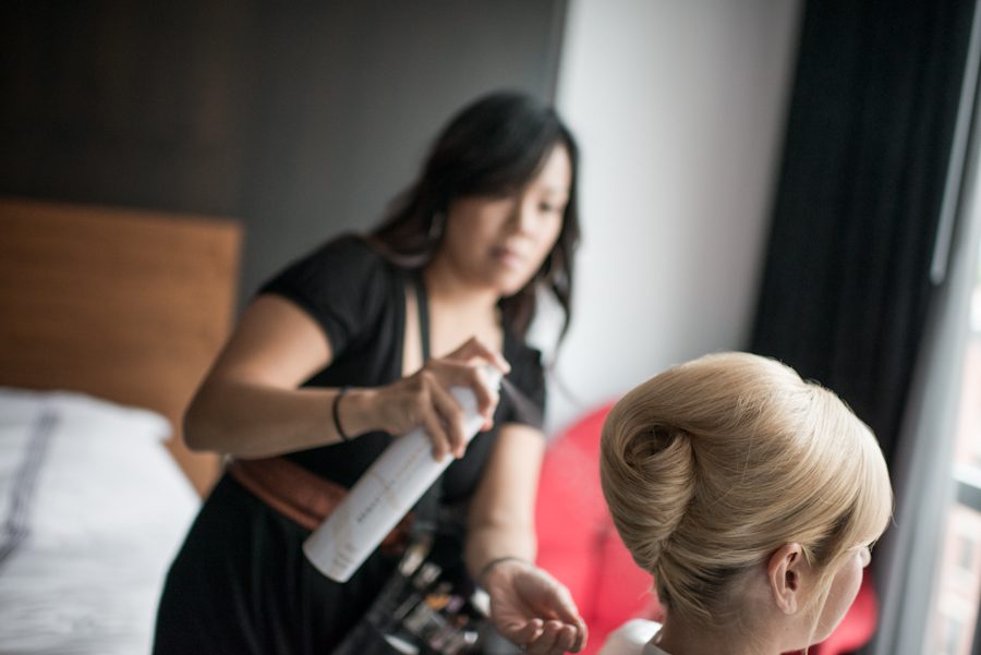 Bride gets her hair done before her New York City Hall wedding. Captured by northern NJ wedding photographer Ben Lau.