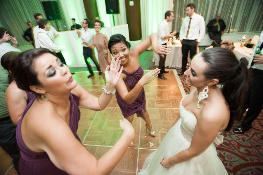 Guests dance during a wedding reception at the Eventi Hotel in New York City. Captured by NYC wedding photographer Ben Lau