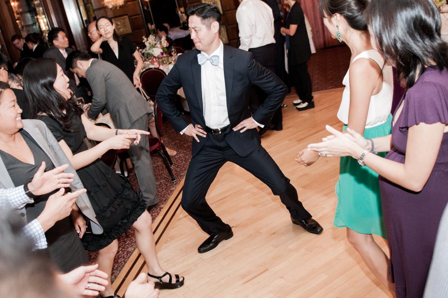 Guests dance at Ed and Sarah's wedding at The Manor in West Orange, NJ. Captured by northern NJ wedding photographer Ben Lau.
