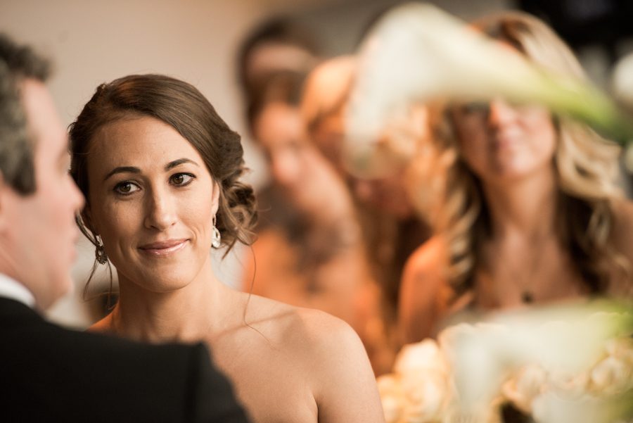 Bride during a wedding ceremony at the Baltimore Museum of Industry in Baltimore, MD. Captured by northern NJ wedding photographer Ben Lau.