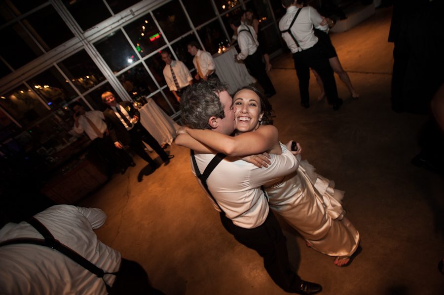 Bride and groom dance at their wedding reception at the Baltimore Museum of Industry in Baltimore, MD. Captured by northern NJ wedding photographer Ben Lau.