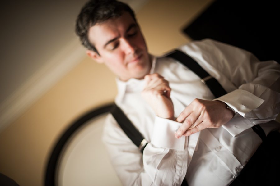 Groom gets ready for his wedding at the Baltimore Museum of Industry. Captured by Ben Lau Photography.