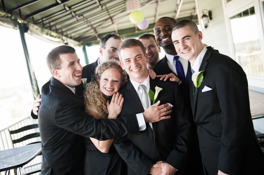 Groom poses with his groomsmen (and groomswoman) before his wedding at the Neshanic Valley Golf Course in Neshanic Station, NJ. Captured by northern NJ wedding photographer Ben Lau.