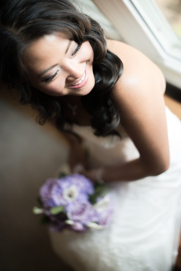 Bride poses for a portrait before her wedding at the Neshanic Valley Golf Course in Neshanic Station, NJ. Captured by northern NJ wedding photographer Ben Lau.