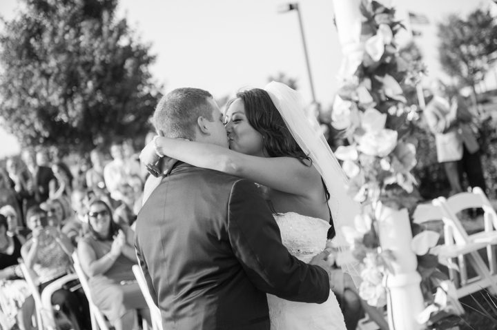First kiss at Kelly and Rob's Neshanic Valley Golf Course wedding in Neshanic Station, NJ. Captured by northern NJ wedding photographer Ben Lau.