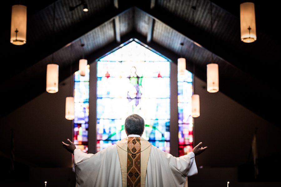 Pastor preaches during a wedding at St. Agnes Parish in Clark, NJ. Captured by northern NJ wedding photographer Ben Lau.