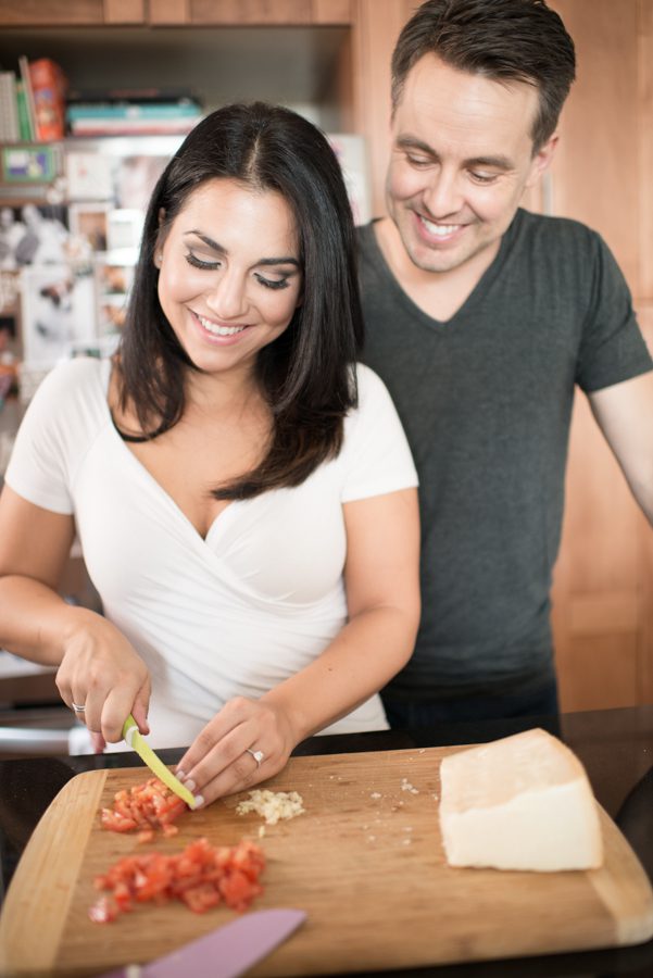 Amedea and Ray cook some pasta during their indoor engagement session with NYC wedding photographer Ben Lau.