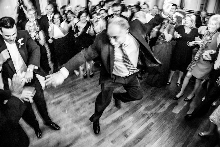 Guests dance during Lauren and Tony's wedding reception at The Belvedere Hotel in Baltimore, MD. Captured by Ben Lau Photography.