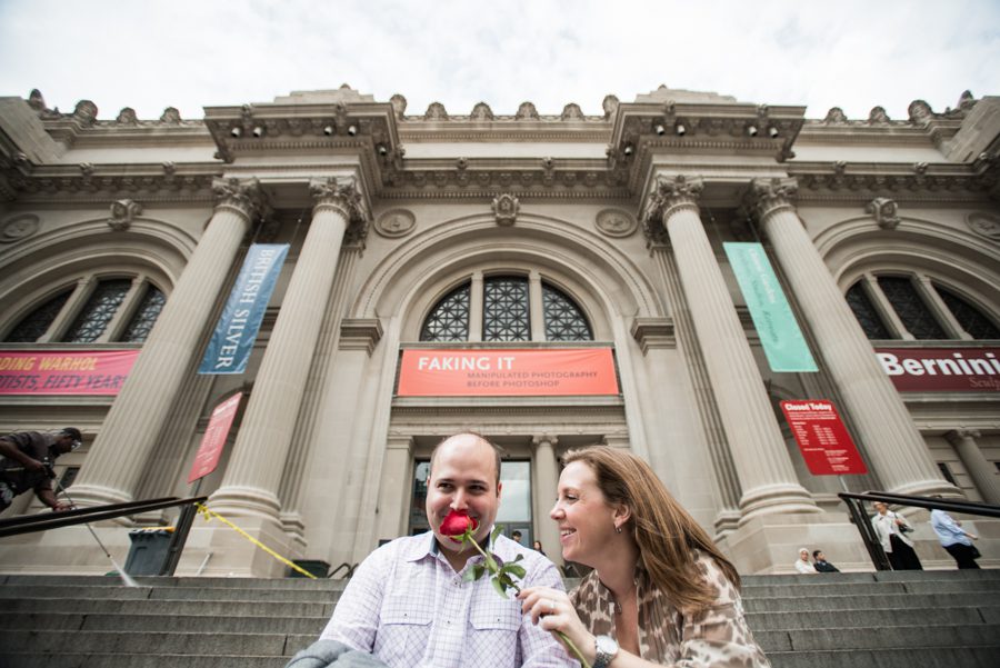 Katie and Craig pose during their engagement session in front of the Metropolitan Museum with NYC wedding photographer Ben Lau.