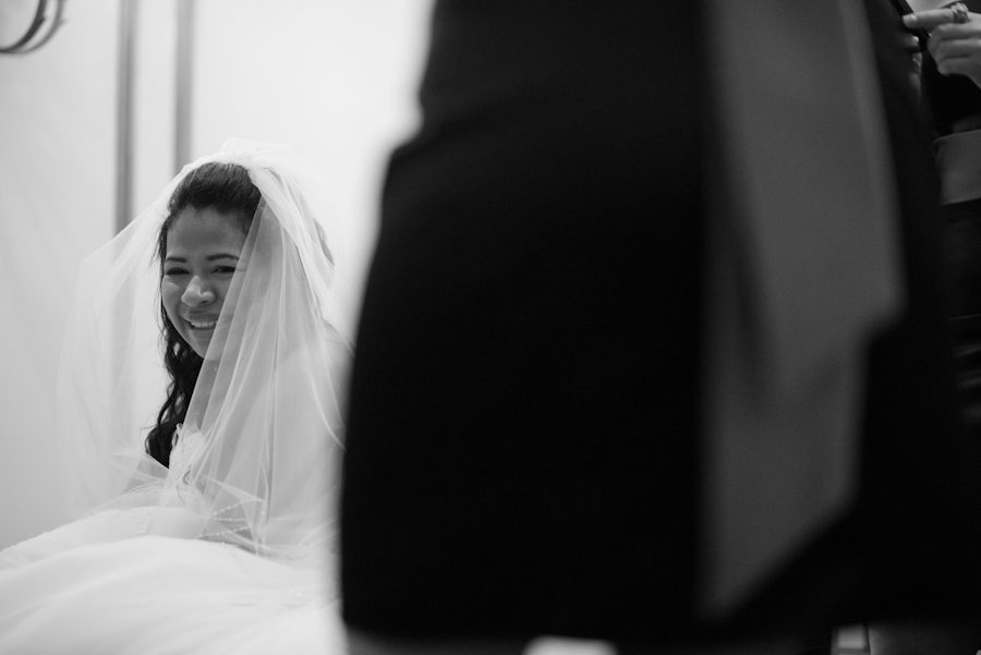 Bride smiles on her wedding day at the Crystal Plaza in Livingston, NJ. Captured by NJ wedding photographer Ben Lau.