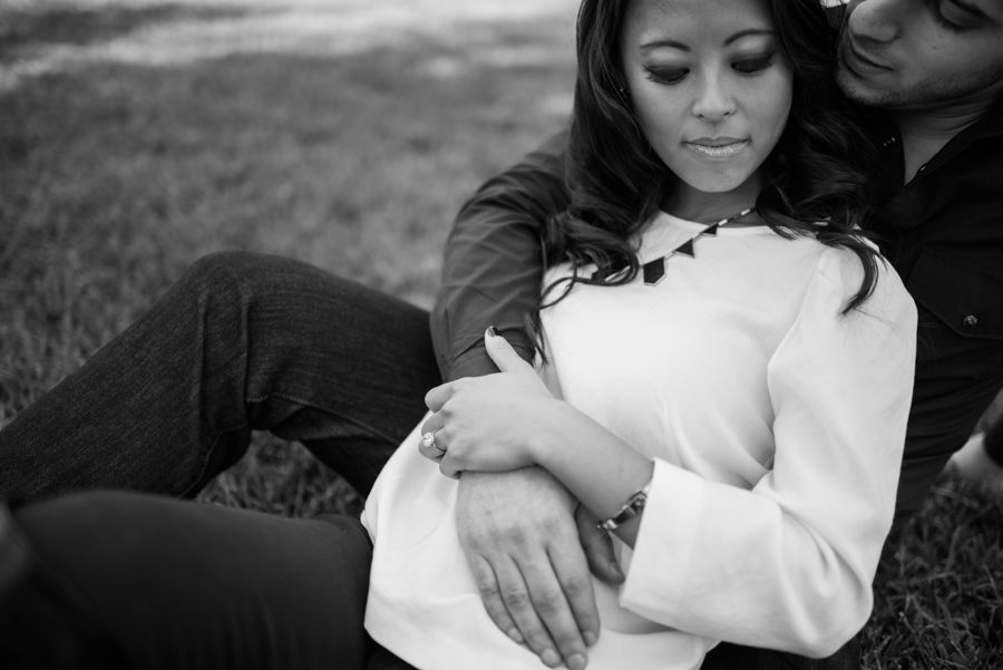Christine and Chalita lay on the grass in historic Georgetown during their engagement session with DC wedding photographer Ben Lau.