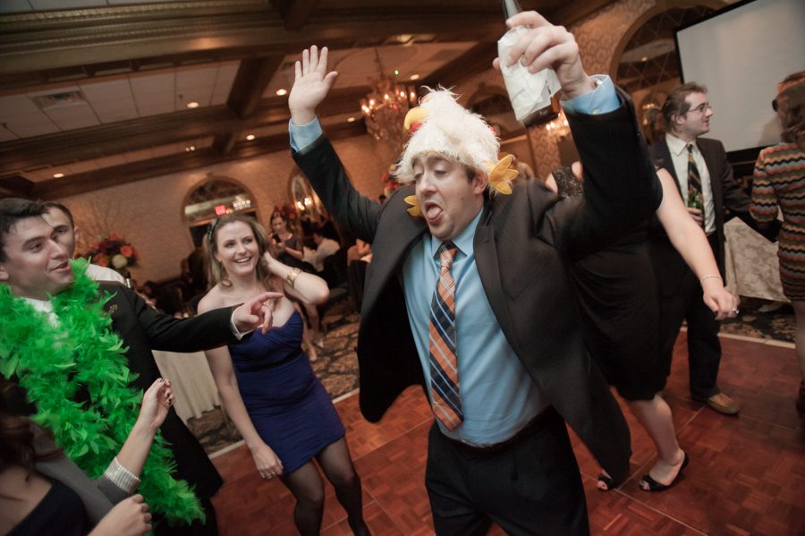 Guests dance during a wedding reception at the Madison Hotel in Morristown, NJ. Captured by NJ wedding photographer Ben Lau.