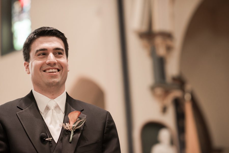 Groom smiles during his wedding ceremony at the Church of Assumption in Morristown, NJ. Captured by NJ wedding photographer Ben Lau.