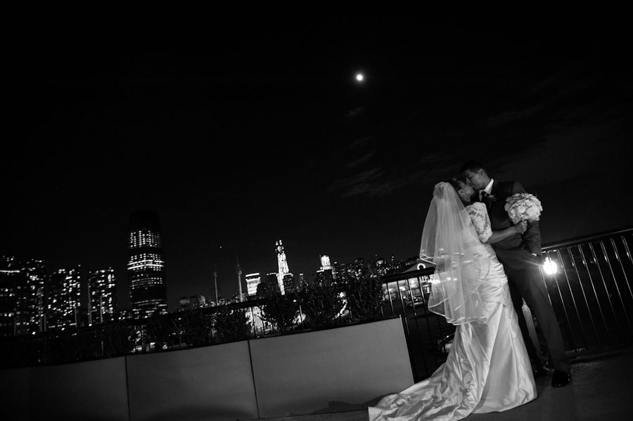 Bride and groom pose for portraits outside of Maritime Parc in Jersey City, NJ. Captured by NJ wedding photographer Ben Lau.