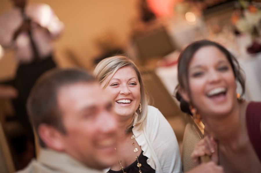 Guests laugh during Maricar and Izaak's wedding at the Marriott Crystal City in Arlington, VA. Caputred by Northern Virginia wedding photographer Ben Lau.