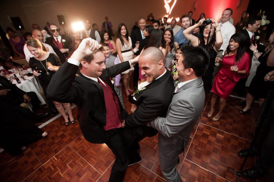 Guests dance during a wedding reception at the Marriott Crystal City in Arlington, VA. Caputred by Northern Virginia wedding photographer Ben Lau.