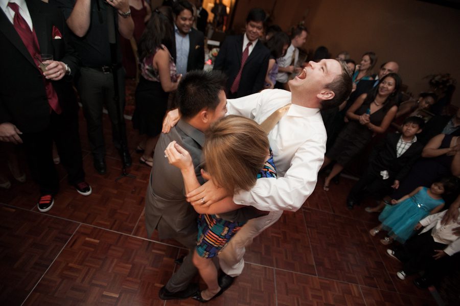 Guests dance during a wedding reception at the Marriott Crystal City in Arlington, VA. Caputred by Northern Virginia wedding photographer Ben Lau.