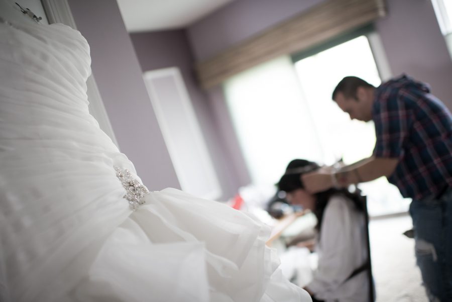 Bride gets ready on the morning of her wedding at The Mill in Spring Lake Heights, NJ. Captured by northern NJ wedding photographer Ben Lau.
