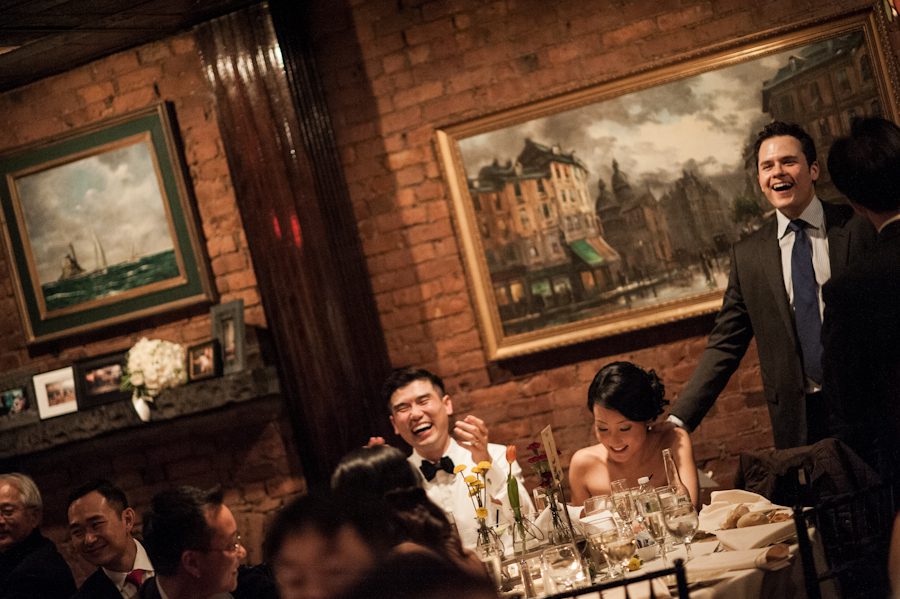 First speeches during a wedding at Morans in Chelsea, NY. Captured by NYC wedding photographer Ben Lau.