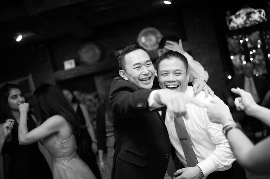 Guests dance during a wedding at Morans in Chelsea, NY. Captured by NYC wedding photographer Ben Lau.