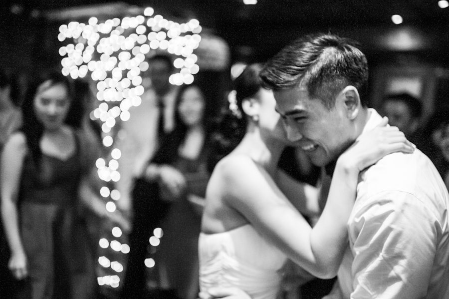 Bride and groom dance during their wedding at Morans in Chelsea, NY. Captured by NYC wedding photographer Ben Lau.