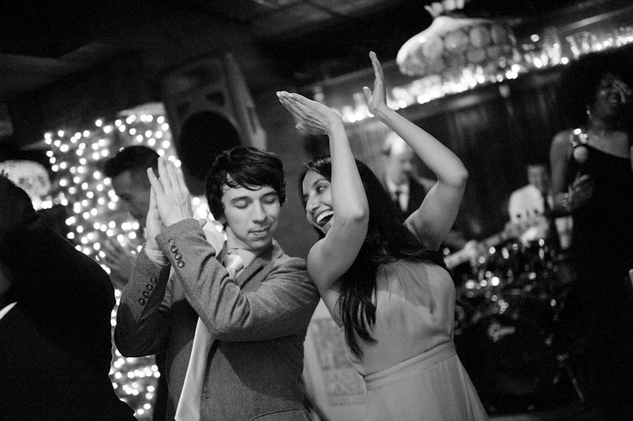 Guests dance during their wedding at Morans in Chelsea, NY. Captured by NYC wedding photographer Ben Lau.