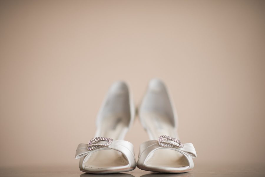 Bride's shoes on her wedding day at Clarks Landing in Point Pleasant, NJ. Captured by northern NJ wedding photographer Ben Lau.