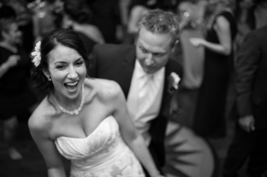 Bride and groom dance during their wedding reception at Clarks Landing in Point Pleasant, NJ. Captured by northern NJ wedding photographer Ben Lau.