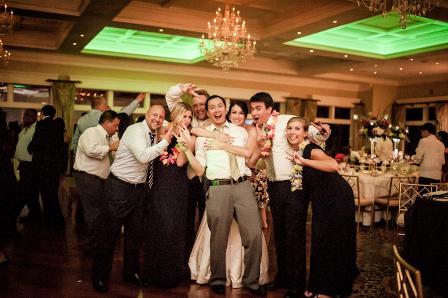 Ben Lau posing with 3 off his couples during a wedding reception at Clarks Landing in Point Pleasant, NJ. Captured by northern NJ wedding photographer Ben Lau.