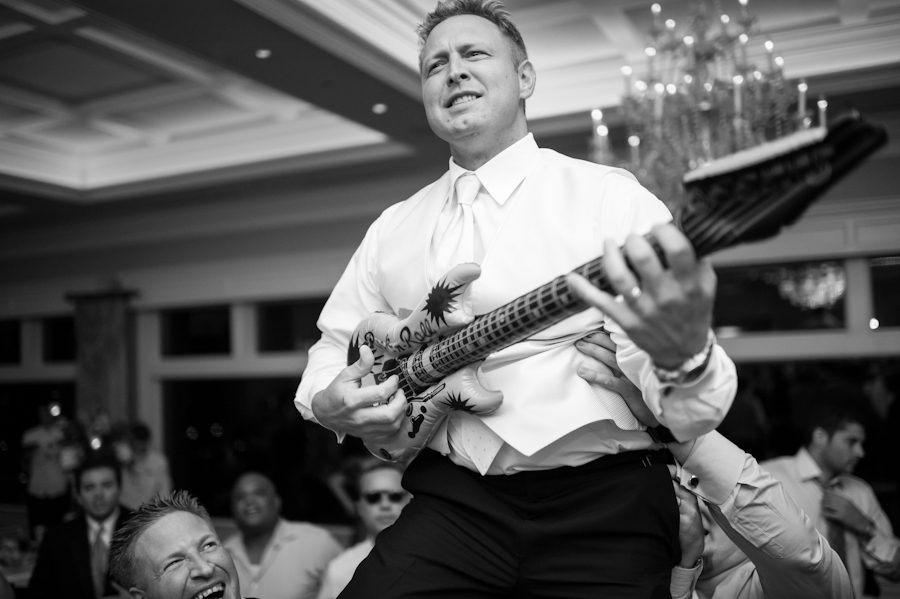 Guests dance during a wedding reception at Clarks Landing in Point Pleasant, NJ. Captured by northern NJ wedding photographer Ben Lau.