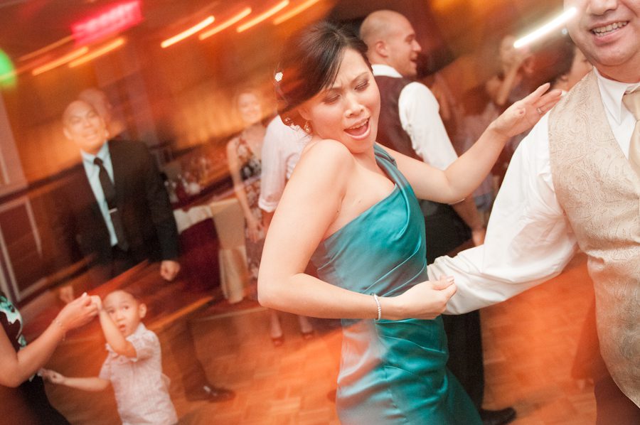 Dancing during a wedding reception at Mudan's in Flushing, NY. Captured by Ben Lau Photography.