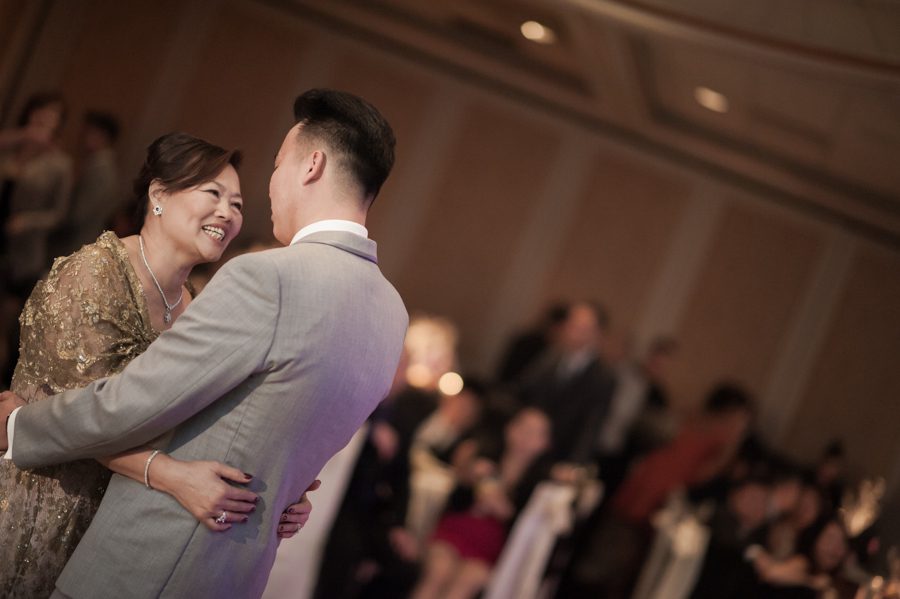 Mother and son dance during a wedding reception at the VIP Country Club in Westchester, NY. Captured by NYC wedding photographer Ben Lau.