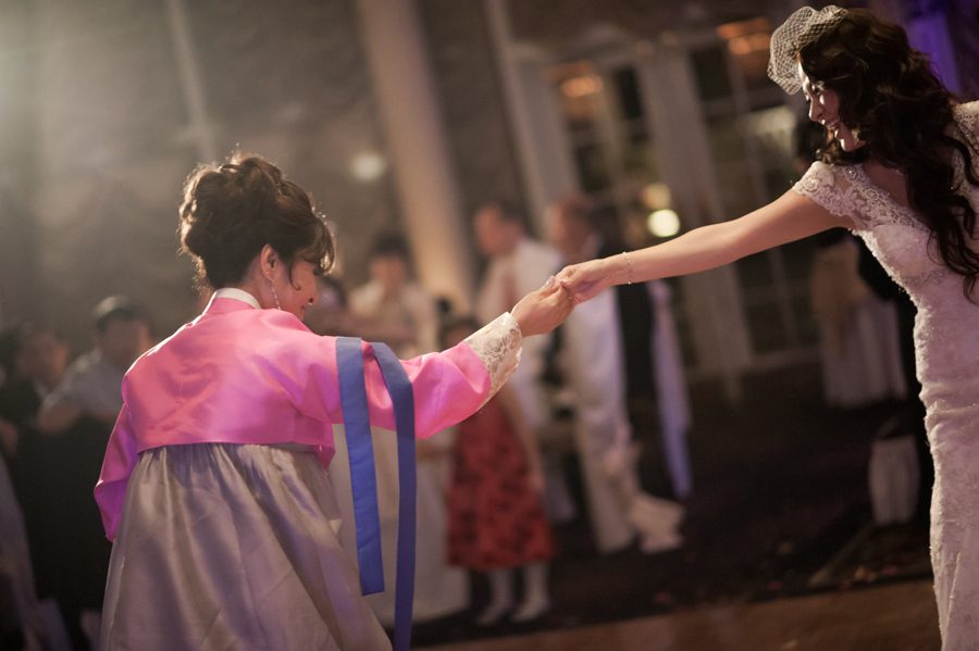 Mother and daughter dance during a wedding reception at the VIP Country Club in Westchester, NY. Captured by NYC wedding photographer Ben Lau.