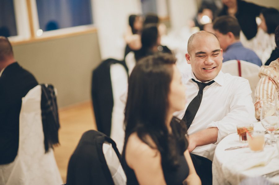 Guests laugh during a Douglaston Manor Wedding. Captured by NYC wedding photographer Ben Lau.