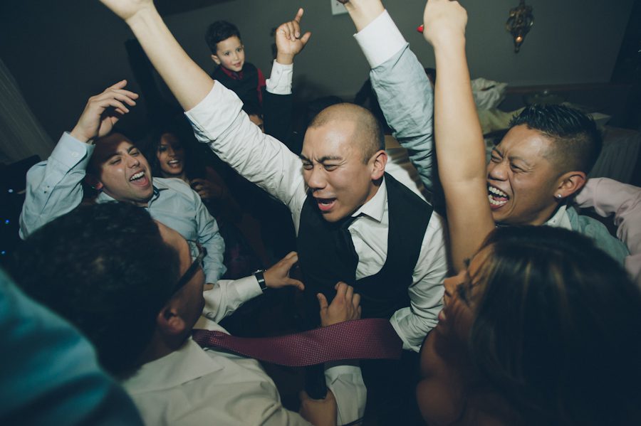Guests dance during Chris and Rosalen's Douglaston Manor Wedding. Captured by NYC wedding photographer Ben Lau.