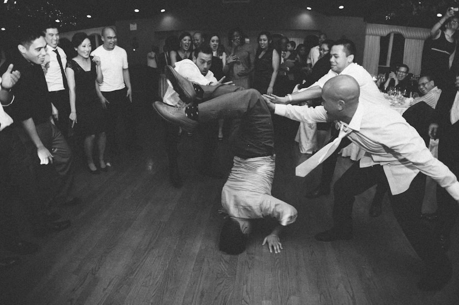 Guests dance during Chris and Rosalen's Douglaston Manor Wedding. Captured by NYC wedding photographer Ben Lau.