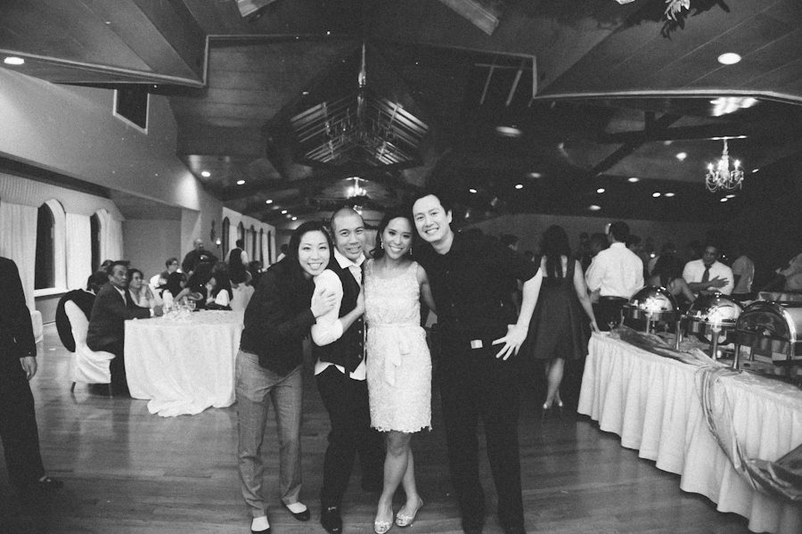 Ben Lau and Karis Lau of Ben Lau Photography pose with Chris and Rosalen at they Douglaston Manor wedding.