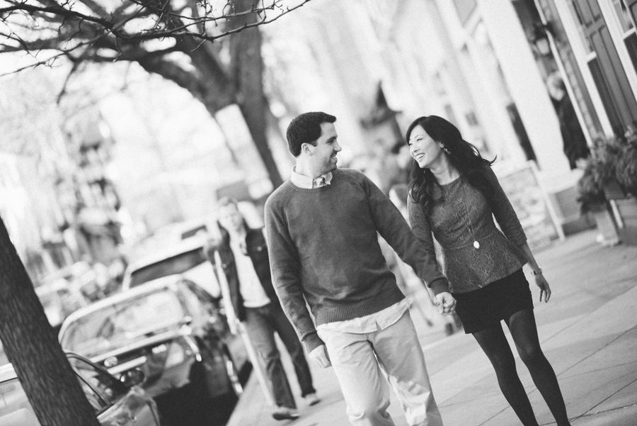 Julia and Jeff walk down Main Street during their engagement session at a Princeton University.