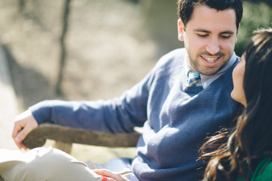 Julia and Jeff share a moment on a bench during their engagement session at a Princeton University.