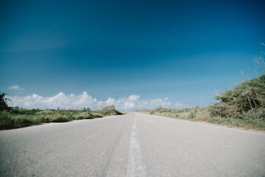 Empty road in Aruba. Captured by destination wedding photographer Ben Lau.