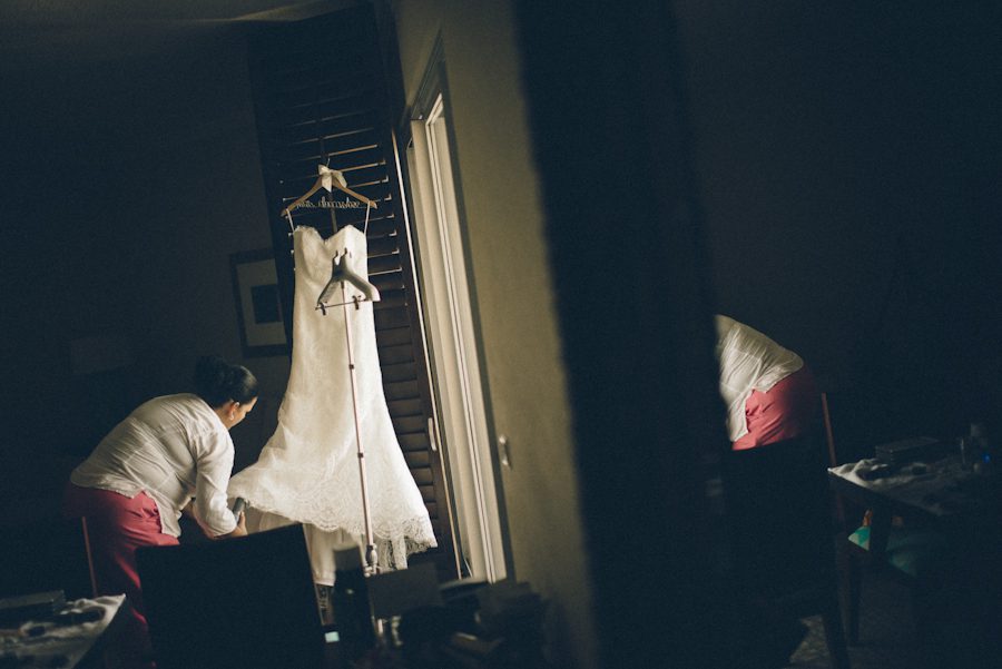 Wedding dress prepares to be steamed at the Radisson Aruba. Captured by destination wedding photographer Ben Lau.