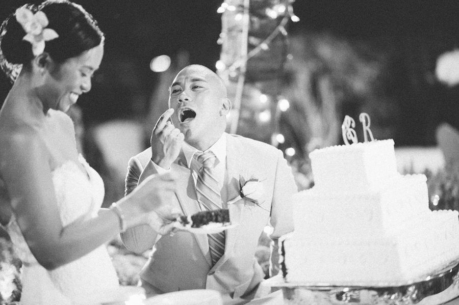 Cake cutting during a Radisson Aruba wedding. Captured by destination wedding photographer Ben Lau.