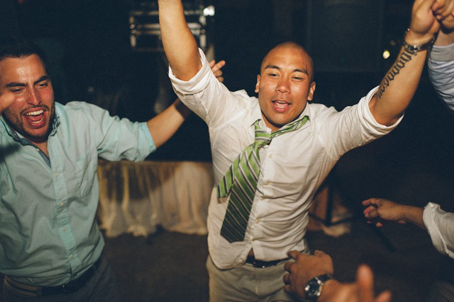 Groom dances during his Radisson Aruba wedding reception. Captured by destination wedding photographer Ben Lau.