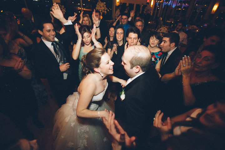Guests dancing during a wedding reception at the Liberty House in Jersey City, NJ. Captured by NYC wedding photographer Ben Lau.