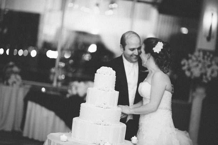 Cake cutting at a wedding reception at the Liberty House in Jersey City, NJ. Captured by NYC wedding photographer Ben Lau.