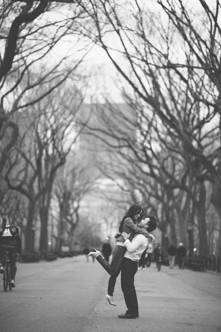 Couple poses for in Central Park for their engagement session in NYC. Captured by NYC wedding photographer Ben Lau.