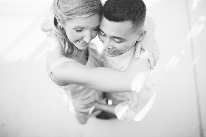 Couple hugs each other during their engagement session, captured by Annapolis wedding photographer Ben Lau.