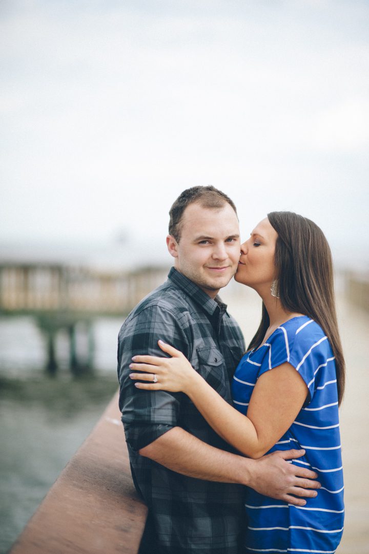 Michelle kisses Bryan during a Baltimore engagement session with Ben Lau Photography.