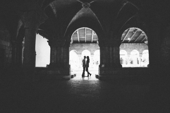 Lisa and Cyrus pose during their engagement session inside an archway with NYC wedding photographer Ben Lau.